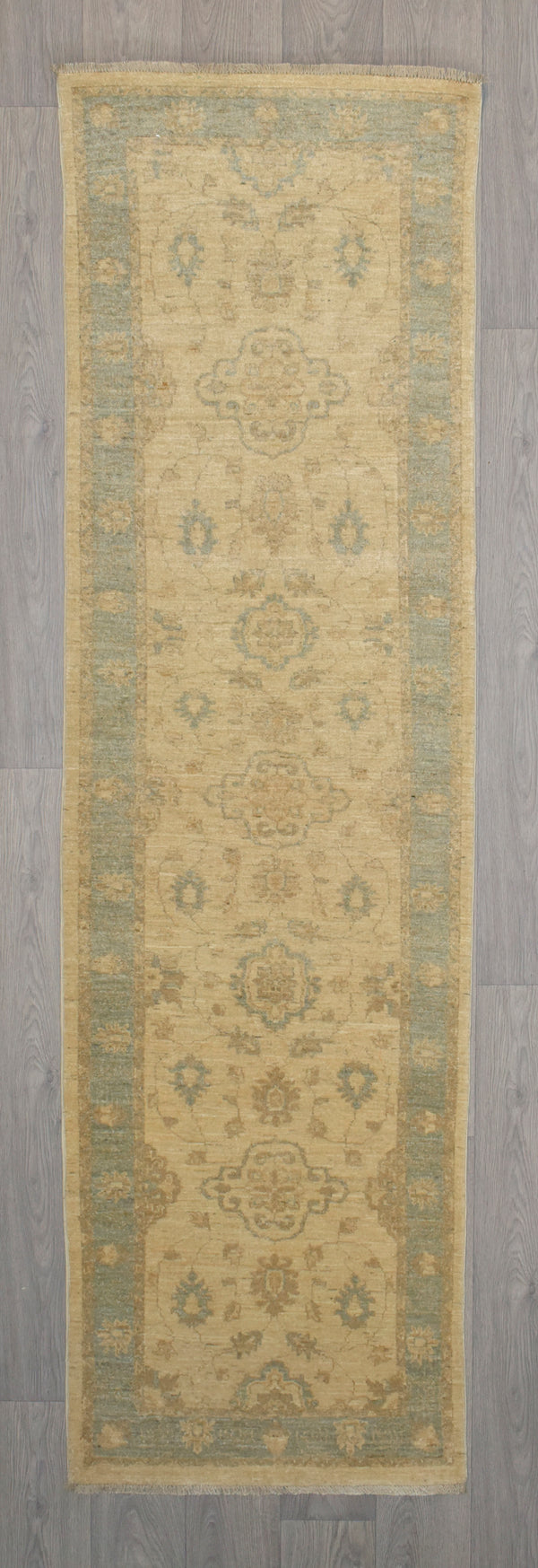 Authentic Hand knotted Natural Afghan Chobi Wool Runner 291cm x 83cm
Finely hand knotted by female artisans of Northern Afghanistan
Cream field tone and indigo border combination made from locally sourced natural dyes.
Good with dark wood to lighten and brighten your interior..
Having a light and darker aspect is a trademark of Handmade Rugs