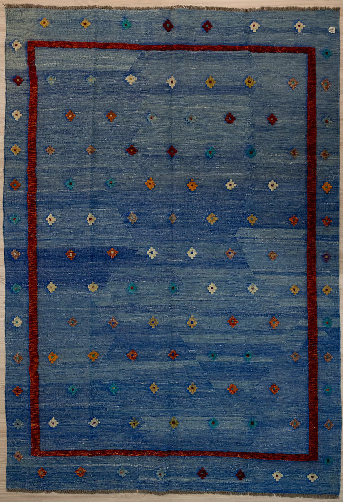 Guaranteed Original Afghan Kilim Pure Wool with textured wool pile diamonds of different colours and a border on a navy blue abrash background.
Texture is formed by deliberately spinninfg together different dye batchesDurable and Wear Resistant Suitable for High Traffic Areasfor High Traffic Areas