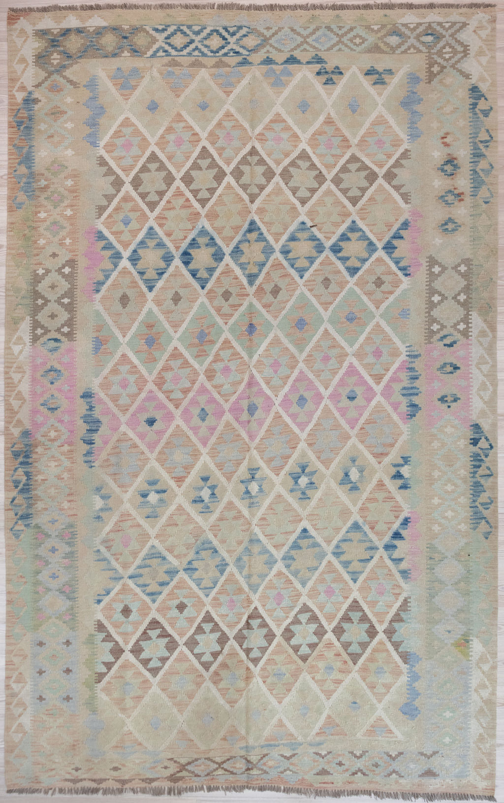 Authentic Hand woven Muted Afghan Boho Wool Kilim 317cm x 207cm
A large rare pale rug with muted field tones all over
Lovely soft contemporary colours.

Easy Care, these rugs improve with age.
Durable and Wear Resistant Suitable for High Traffic Areas