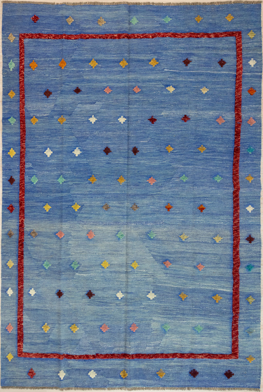 Azure Blue Barjasta Afghan Wool Kilim 291cm x 204cm
Guaranteed Original Afghan Kilim Pure Wool with textured wool pile diamonds of different colours and a magenta border on an azure blue abrash background.
Abrash effect is formed by deliberately spinning together different dye batches
Durable and Wear Resistant Suitable for High Traffic Areas