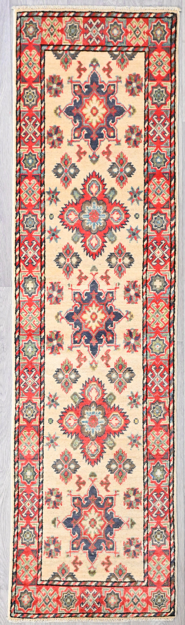 Authentic Handknotted Beige Cream Afghan Kazak Wool Runner 216cm x 58cm
Lovely saturated natural dyed colours in bold Aztec Style design.featuring star motifs. full border and short fringes. Practical and striking runner.