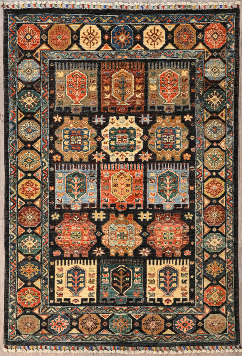 Authentic Hand woven Black Afghan Chobi Wool Rug 173cm x 120cm
Beautiful black wool framework on a lovely walled garden design. A Garden filled with flowering fruiting trees. Colours made from naturally sourced vegetable dyes. What a beauty!

Having a light and dark side is a trademark of Handmade Rugs
Durable and Wear Resistant Suitable for High Traffic Areas