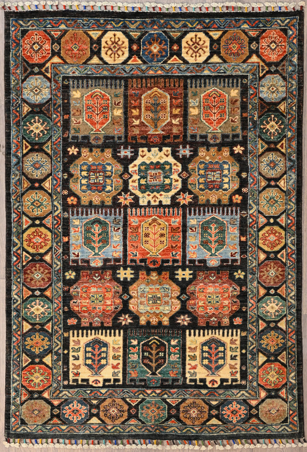 Authentic Hand woven Black Afghan Chobi Wool Rug 173cm x 120cm
Beautiful black wool framework on a lovely walled garden design. A Garden filled with flowering fruiting trees. Colours made from naturally sourced vegetable dyes. What a beauty!

Having a light and dark side is a trademark of Handmade Rugs
Durable and Wear Resistant Suitable for High Traffic Areas