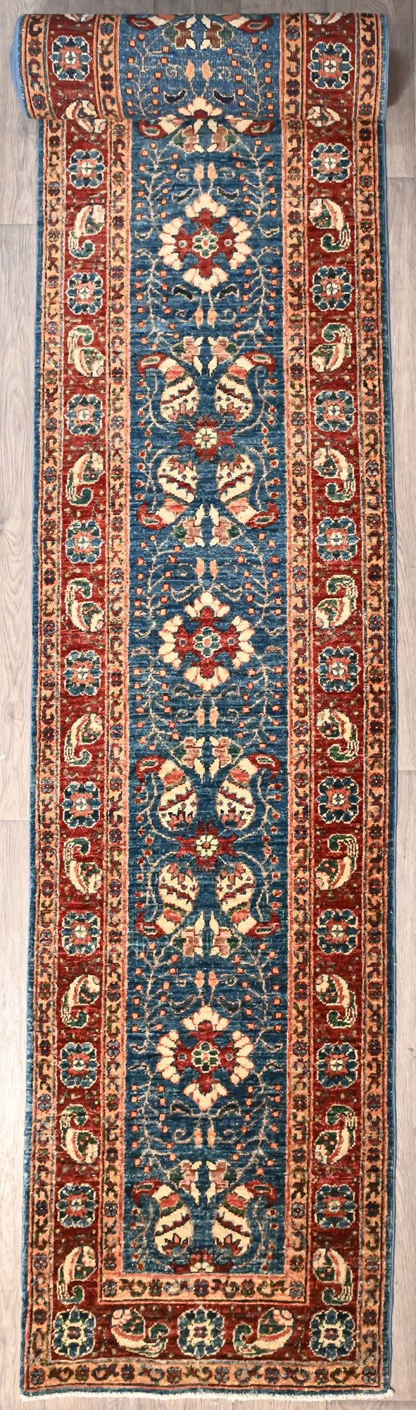 Authentic Handknotted Blue Afghan Chobi Extra-long Wool Runner 688cm x 80cm
Rare Extra Long Veg Dye Runner
Navy centre &amp; red border tones derived from natural veg/plant based dyes