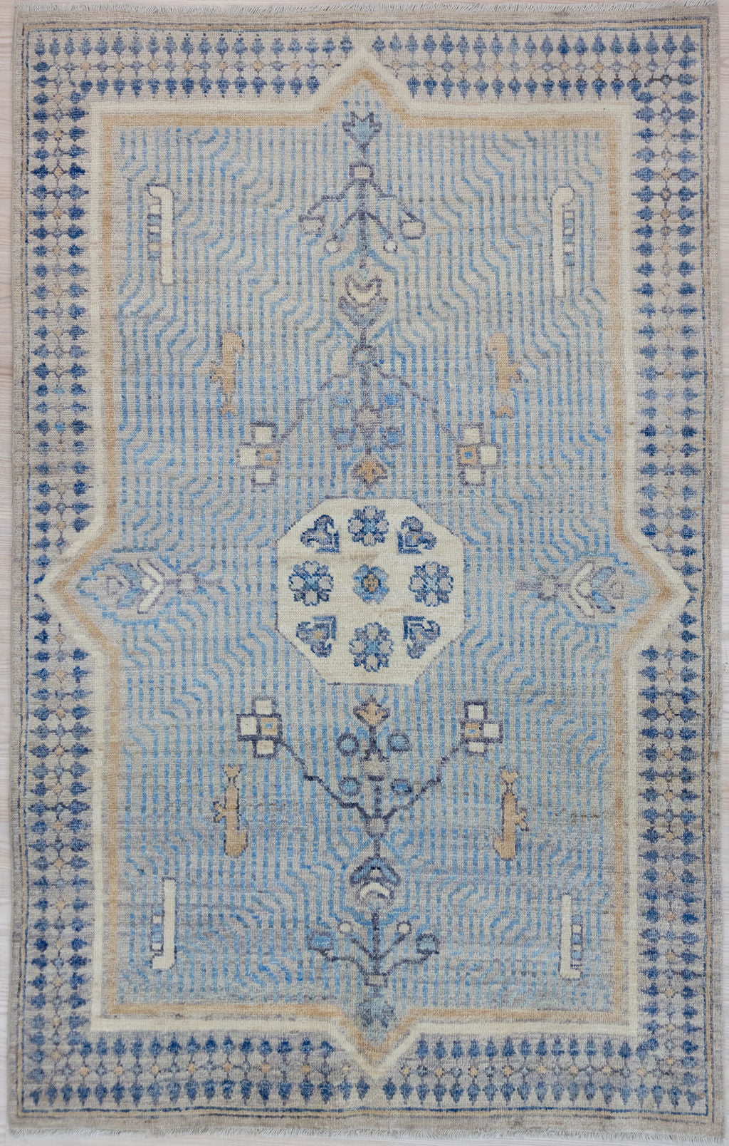 Authentic Handknotted Blue Afghan Chobi Wool Rug 190cm x 122cm
Beautiful muted tones all made from natural vegetable dyes including indigo.
An unusual meditative design suggesting ripples in a fountain or maybe a raked gravel, zen garden. Colour variations within the blue woolsadds to the visual ripple effect

Unique contemporary design adaption, perfect for a special space&nbsp;
Having a light and darker aspect is a trademark of Handmade Rugs