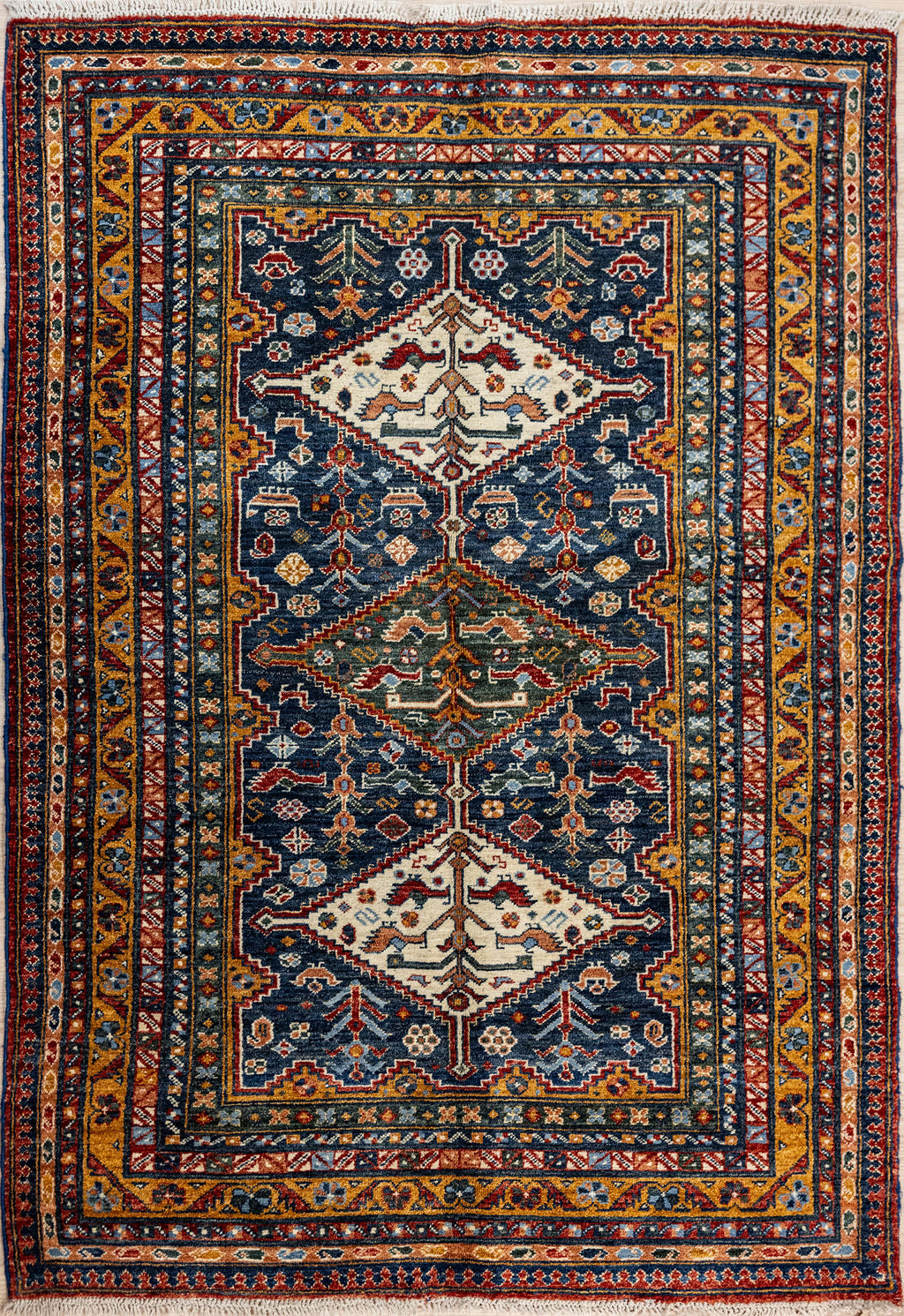 Authentic Handknotted Blue Afghan Chobi Wool Rug 202cm x 156cm woven in Central Asia
A unique all over design of abstracted birds, botanical elements and other motifs woven in from cultural memory makes a rug to intrigue the eye.
Two large cream symmetrical lozenge on each end a central element reference Shiraz or Qashquai style. If something is good it's worth repeating, but in lighter weight for a more temperate climate
