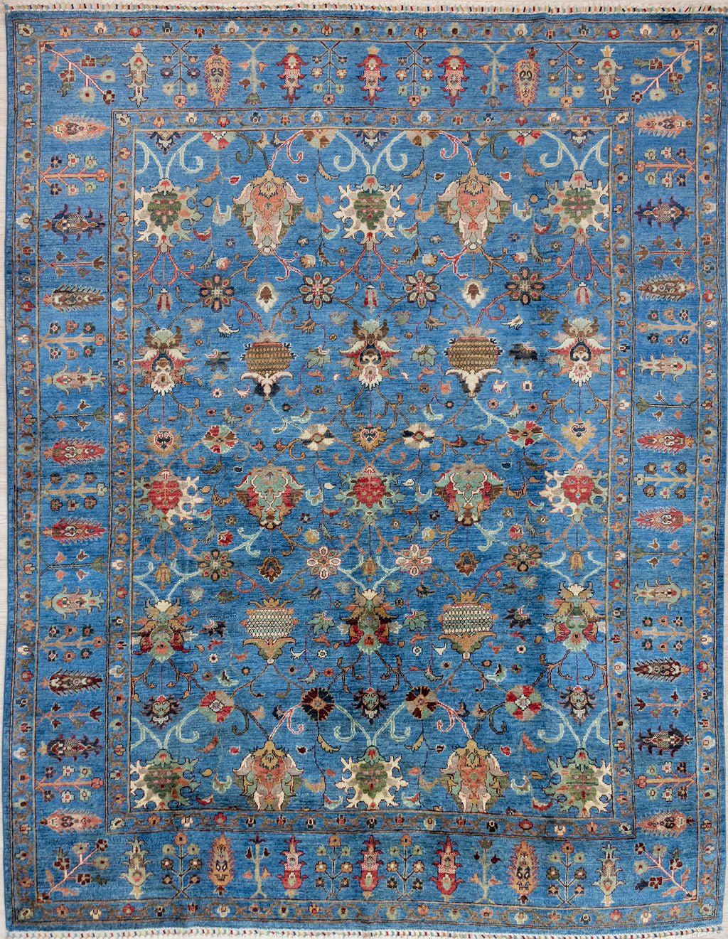 Authentic Hand knotted deep Sky Blue Afghan Sultani Chobi Wool Rug 298cm x 247cm A one of-a-kind botanical design that feels like laying in a field of flowers looking at a cloudless sky.
Lovely colour palette with an array of rustic multicolour tones on cerulean blue.
Ariana tassels woven on the top and bottom edges.
Having a light and darker aspect is a trademark of Handmade Rugs
Durable and Wear Resistant making it suitable for High-Traffic Areas