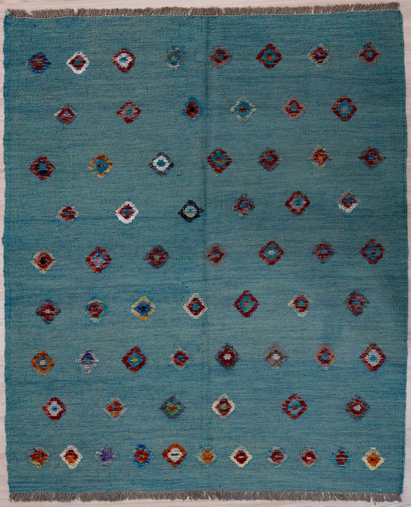 Blue Barjasta Afghan Wool Kilim 194cm x 161cm
Guaranteed Original Pure Wool with textured wool pile diamonds of different colours and a border on an ultramarine blue abrash background.&nbsp;
Texture is formed by deliberately spinninfg together different dye batches