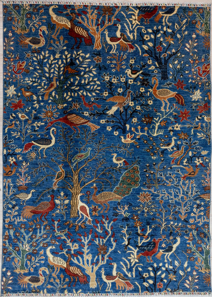 Authentic Hand woven deep dark turquoise Blue Pictorial Afghan Chobi Wool Rug 232cm x 172cm made by local artisans of Afghanistan
A Rural design showcasing the flora and fauna of the barnyard, the orchard and  the forest in the Northern mountains.
Colour tones all made from locally sourced vegetable dyes including indigo and local natural wool colours.

Having a light and dark aspect is a trademark of Handmade Rugs 