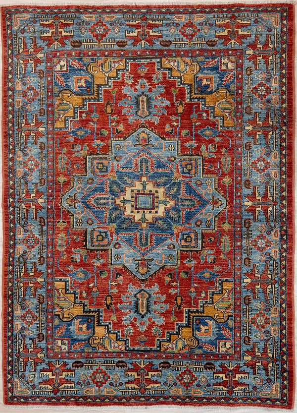 Authentic Handknotted Blue Red Afghan Chobi Wool Rug 203cm x 146cm woven in Central Asia
A unique adaption of traditional rug design bringing a touch of modern contemporary to your home.
Lovely colour palette of red field along with Blue architectural medallions and a mix of other natural dyed colours pink, mustard, burgundy in a wide blue border.