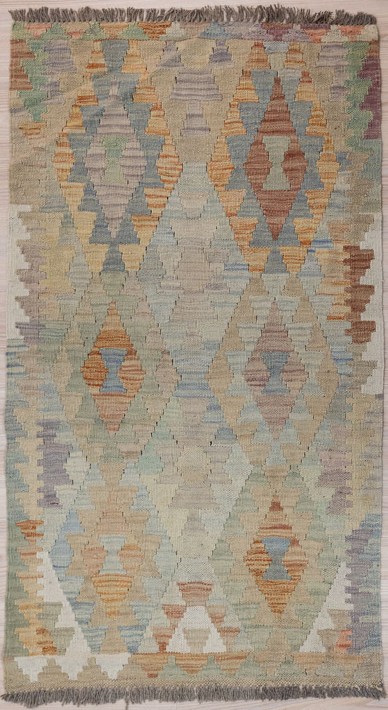 Authentic Hand woven Boho Afghan Kilim Runner 149 cm x 79cm
A small size runner in rare pale muted field tones all overLovely soft contemporary colours.
These traditional flexible wool rugs have many uses in the modern Boho home ,can be used on chairs or in bathroom.Easy Care, these rugs improve with age