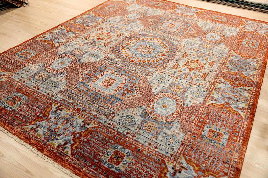 Authentic Hand woven Burnt Orange Afghan Mamluk Chobi Wool Rug 306cm x 244cm woven in Shebarghan, Afghanistan
Inspired by the ancient Egyptian Mamluk design which consists of a Geometric patterns all over&nbsp;
Beautiful combination of burnt orange centre and wide multicolour border tones all made from local veg dyes
