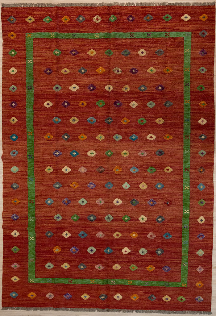 Large Burnt Orange Barjasta Afghan Wool Kilim 291cm x 207cm
Guaranteed Original  Pure Wool with textured wool pile diamonds of different colours and a border on a burnt orange abrash wool background.
Texture is formed by deliberately spinning together different dye batches