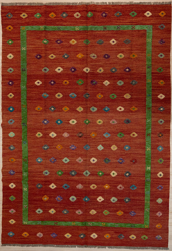 Large Burnt Orange Barjasta Afghan Wool Kilim 291cm x 207cm
Guaranteed Original  Pure Wool with textured wool pile diamonds of different colours and a border on a burnt orange abrash wool background.
Texture is formed by deliberately spinning together different dye batches