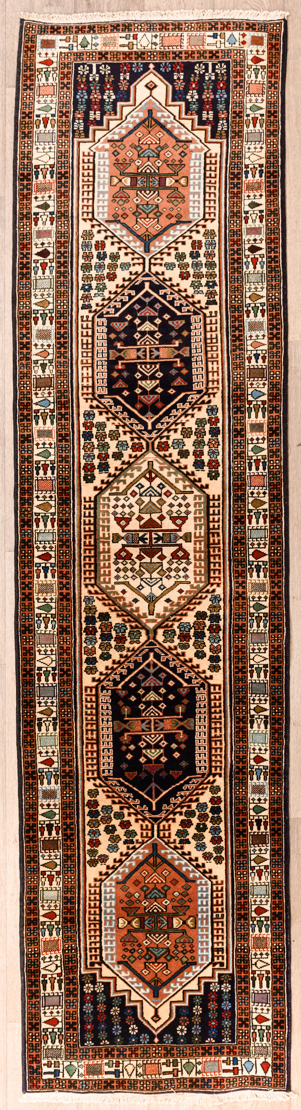 Authentic Handknotted Cream Persian Ardebil Wool Runner 303cm x 76cm
White/Cream field colour tone with multicolour medalions throughout
Pictorial motifs woven through the centre and; border of the Runner