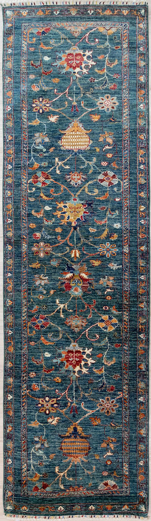 Dark Green Afghan Sultani Chobi Wool Runner 253cm x 80cm. Made with a beautiful rare calming and grounding emerald green base colour and multicoloured colour-fast veg dyed renditions of floral and vine elements.
Woven in Shebarghan Central Afghanistan, this lovely spirited garden inspired design and colour combination enhances and brightens your hallway as well as reducing noise.