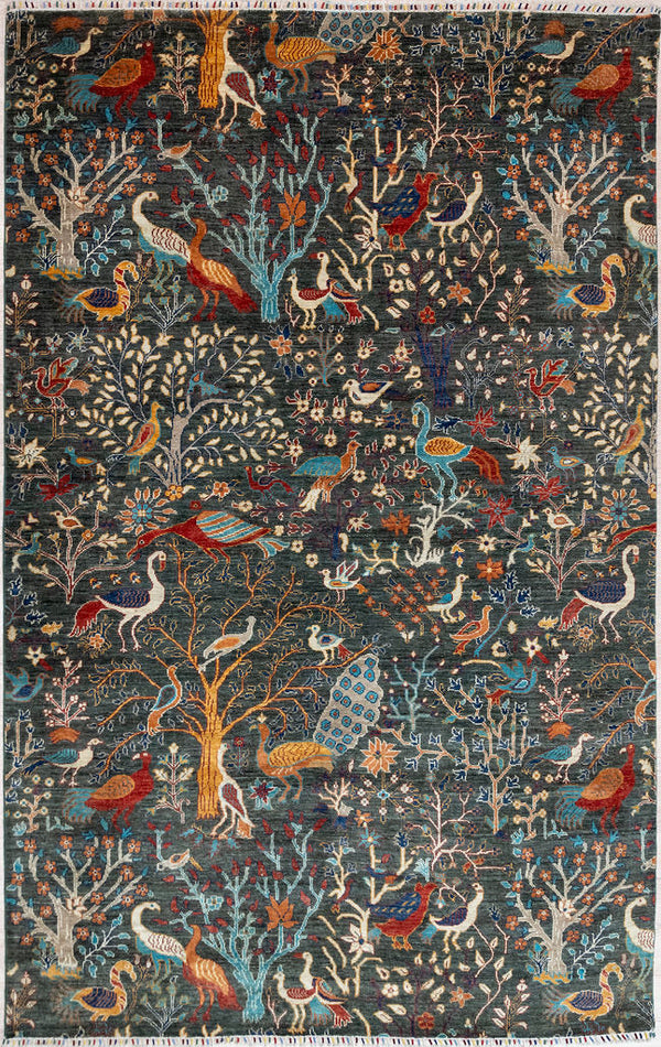 Authentic Hand woven Dark Green Dark Green Pictorial Afghan Chobi Wool Rug 298cm x 202cm made by local artisans of Afghanistan
Deep sage green background is made by spinning together different dye batches of mountain ghazni sheeps wool.
Colour tones all made from locally sourced vegetable dyes including indigo and weld.
Depicted is the variety and abundance of flora and fauna, both wild an domestic in the mountains of Afghanistan where the rugs are woven.