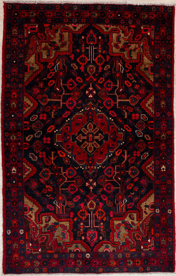 Bring a touch of Persian heritage into your home with this Dark Red Persian Hamadan Wool Rug 217cm x 140cm
Handknotted in the ancient city of Hamadan, this rug boasts a classic pattern and is made of pure sheep's wool for a soft, luxurious feel under your feet.
Deep indigo/black wool background contrasts with intense dark red floral designs. Details in cream complete the picture.
All coulours are natural vegetable dyes or colours of sheep. Dye techniques are passed down over generations