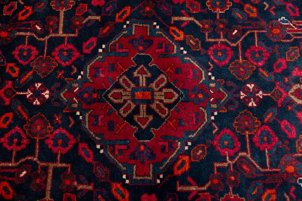

Bring a touch of Persian heritage into your home with this Dark Red Persian Hamadan Wool Rug 217cm x 140cm
Handknotted in the ancient city of Hamadan, this rug boasts a classic pattern and is made of pure sheep's wool for a soft, luxurious feel under your feet.
Deep indigo/black wool background contrasts with intense dark red floral designs. Details in cream complete the picture.
All coulours are natural vegetable dyes or colours of sheep. Dye techniques are passed down over generations