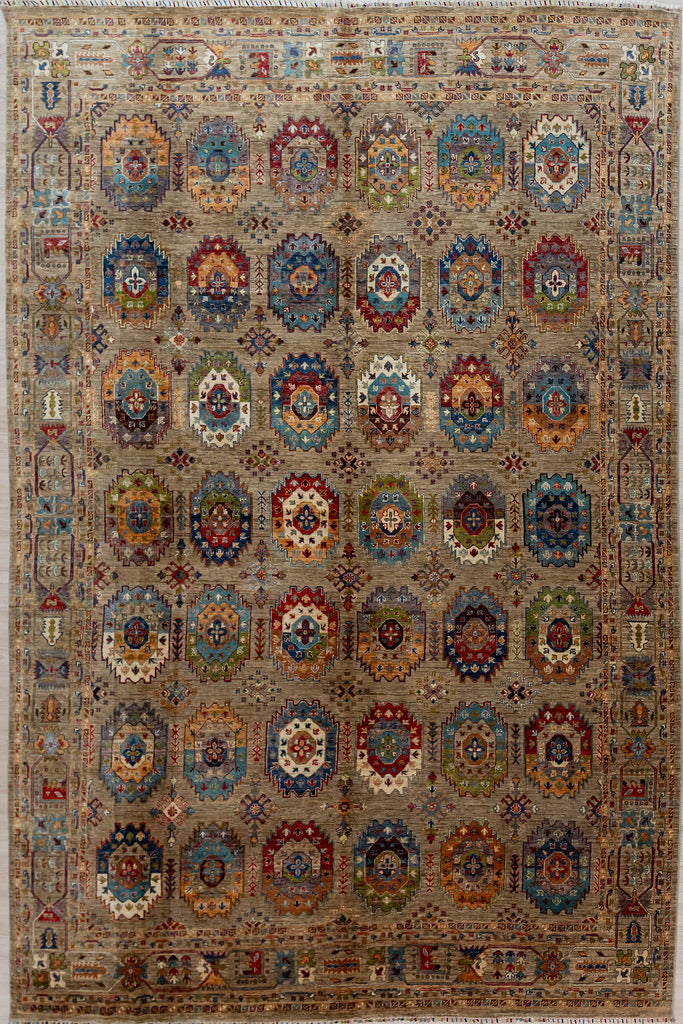 Authentic Large Handmade Fawn Afghan Suzani Chobi Wool Rug 372cm x 278cm made by local artisans of Afghanistan.
A sprinkling of Bukhara elephant foot motifs, interspersed with atomic snowflakes reflects a Mountain Winter.A backround of natural Ghazni mountain sheeps wool displays guls in the full range of beautiful natural veg dyed colours accented with natural cream.
A one of a kind example of dyeing and weaving artistry