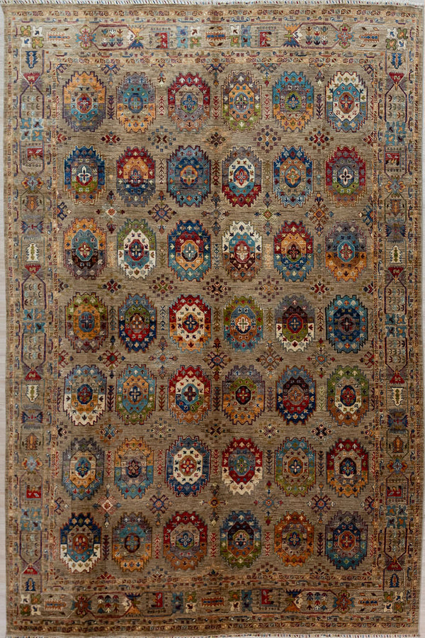 Authentic Large Handmade Fawn Afghan Suzani Chobi Wool Rug 372cm x 278cm made by local artisans of Afghanistan.
A sprinkling of Bukhara elephant foot motifs, interspersed with atomic snowflakes reflects a Mountain Winter.A backround of natural Ghazni mountain sheeps wool displays guls in the full range of beautiful natural veg dyed colours accented with natural cream.
A one of a kind example of dyeing and weaving artistry