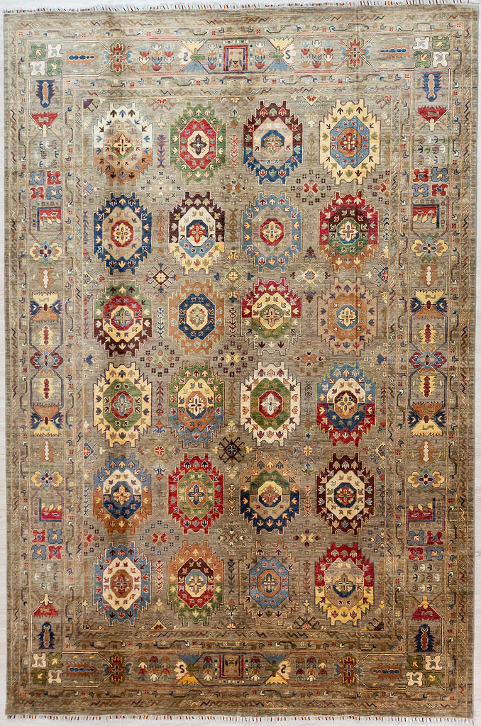 Authentic Large Handmade Fawn Geometric Fawn Afghan Suzani Chobi Wool Rug 362cm x 279cm made by local artisans of Shebarghan, Afghanistan
A design of Bukhara elephant foot motifs, splendidly varied in slightly differing patterns, displaying a full range of beautiful subtle paler natural veg dyed colours

together with the fawn background made from natural undyed sheep wool, this is truly a one of a kind example of dyeing and weaving artistry