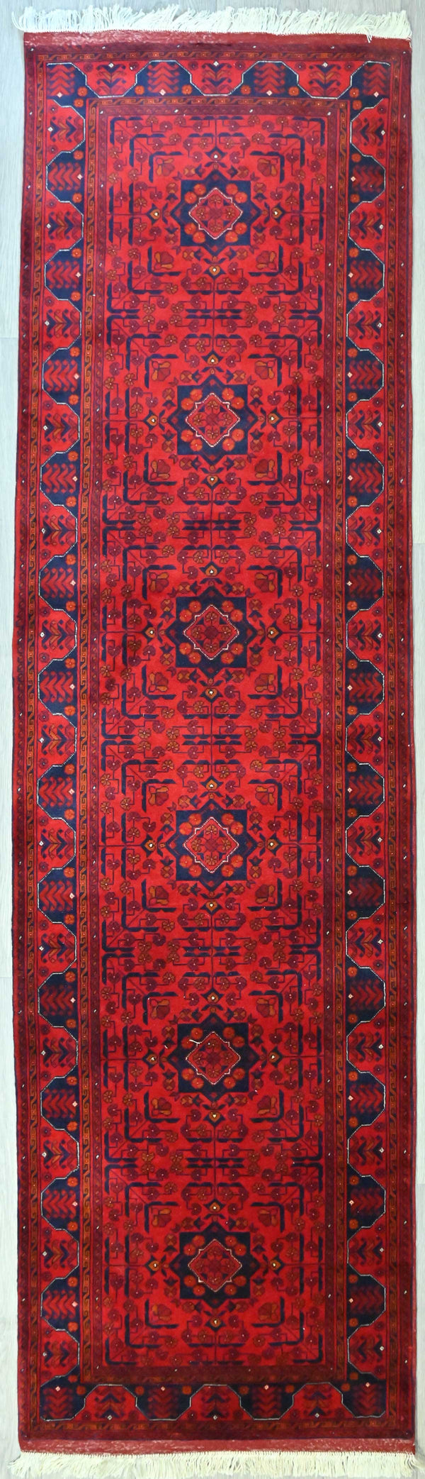 Fine Red Afghan Beljick Wool Runner 297cm x 82cm uaranteed Original Fine Red Afghan Beljick Wool Runner 297cm x 82cm weaved in Central Afghanistan
The beljick rugs are of the highest of quality in the Afghani range and showcases the skill of these master weavers
This rare runner has an extremely immaculate knot weave, the front and back of this rug is almost identical