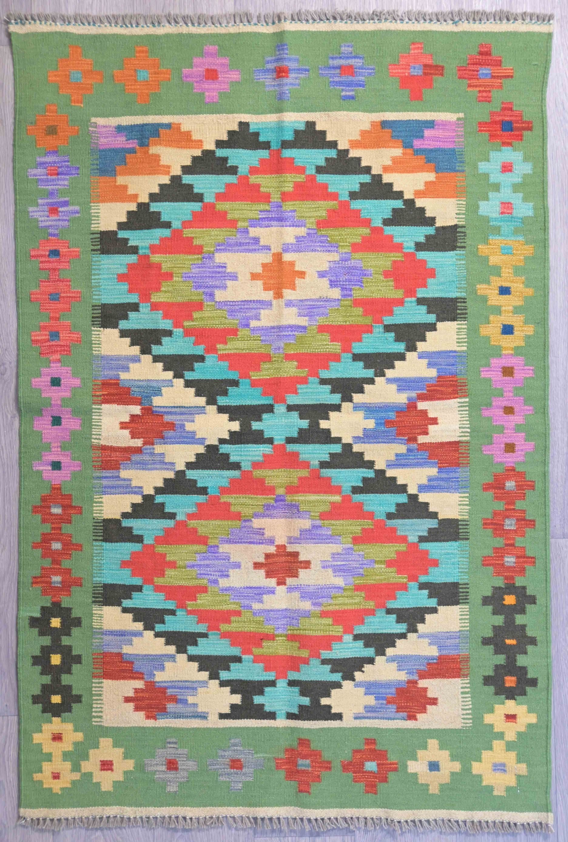 Authentic Handknotted Green Afghan Boho Wool Kilim 157cm x 104cm
Fresh vibrant natural plant based colours for the modern interior
Durable and Wear Resistant Suitable for High Traffic Areas
It Has Taken Approximately 3 Months of Weaving to Complete This Piece
