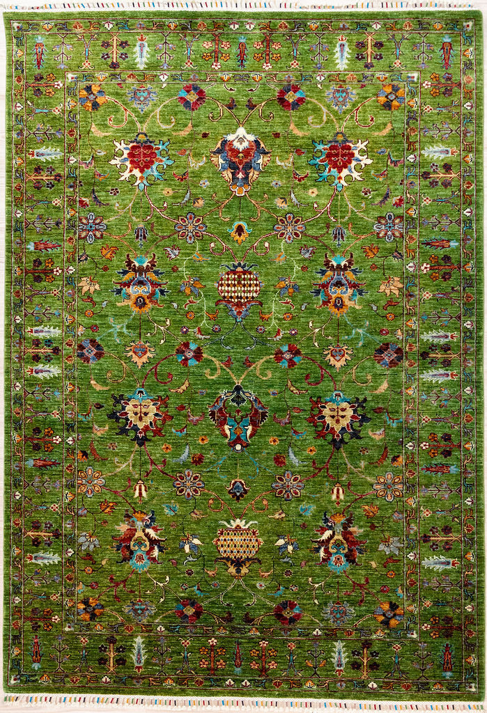 Authentic Handknotted Green Afghan Sultani Chobi Wool Rug 243cm x 169cm
Finely handknotted by female artisans of Northern Afghanistan
&nbsp;Motifs depicting exhuberant vegetation in ornate modern baroque style. This rug can complement gilded antique European furniture.
Finished with distinctive silk bound tassels
Fantastic deep olive green wool colour is so silky and alive. Colour tones made from locally sourced natural veg dyes - crushed walnuts, indigo, pomegranate skin.