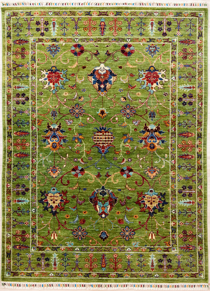 Authentic Handknotted Green Afghan Sultani Chobi Wool Rug 202cm x 152cm
Finely hand knotted by female artisans of Northern Afghanistan
Motifs depicting botanical themes in ornate modern baroque style. This rug can complement gilded antique European furniture.
With meaningful tree of life borders and carefully finished with distinctive silk bound Arianna tassels.
Dusty olive green wool colour is silky and lively. Colour tones made from locally sourced natural veg dyes -