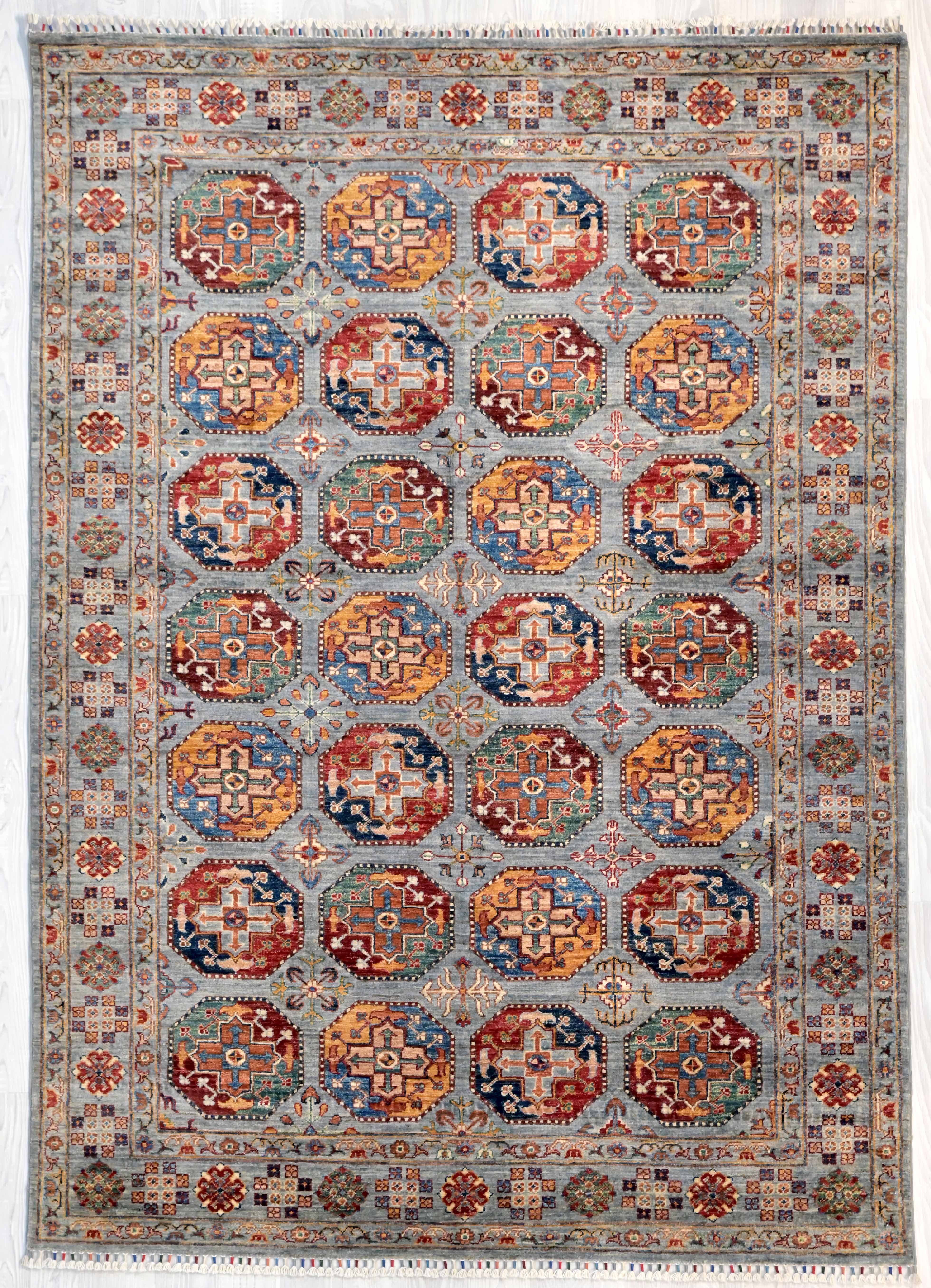 Grey Afghan Filpa Khurjin Wool Rug 244cm x  170m a gorgeous hand knotted rug with a wonderful rabbit grey modern background colour . Made from natural colours of sheep and vegetable dyed handspun wool