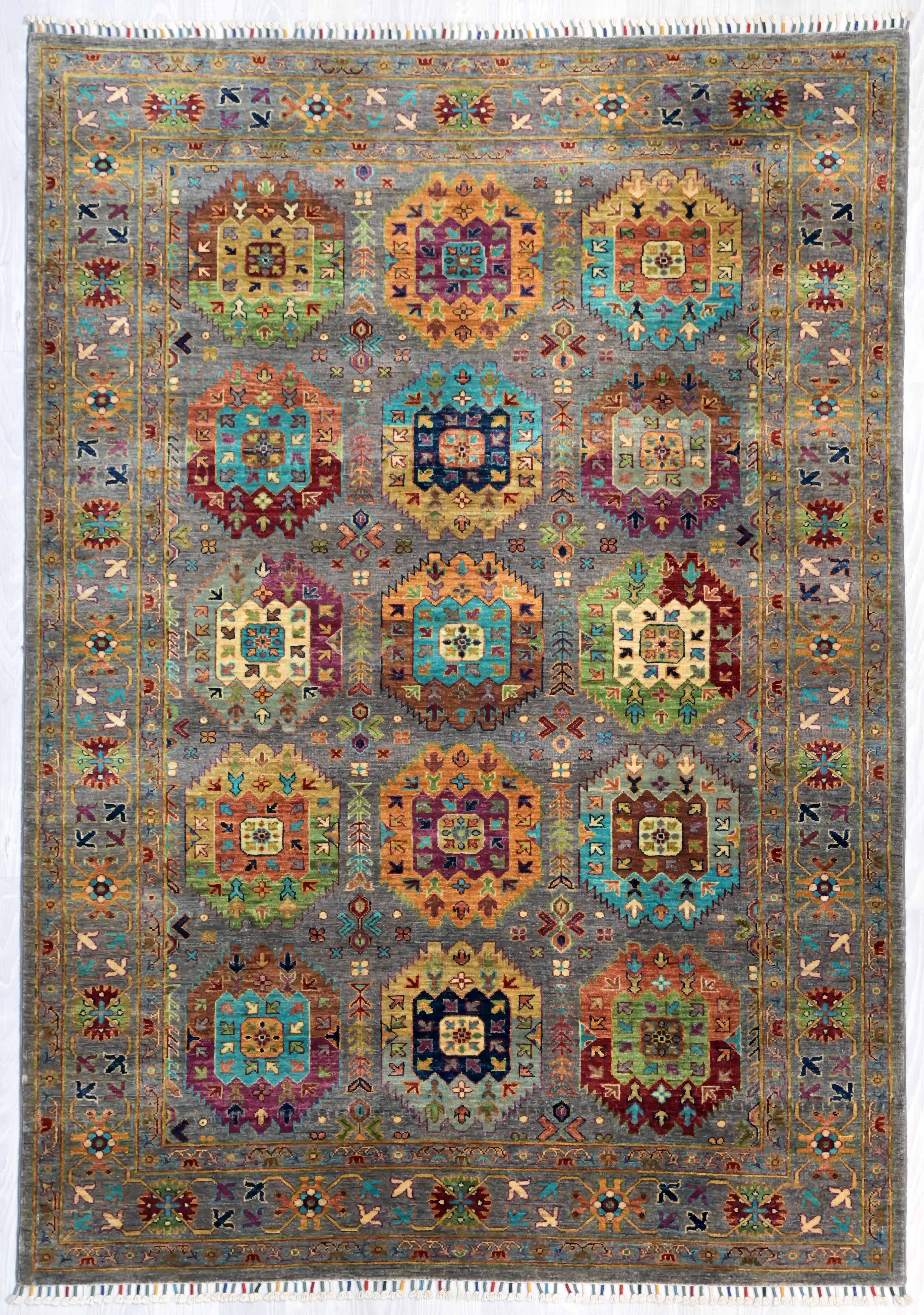 Authentic Handknotted Grey Afghan Sultan Khurjin Wool Rug 234cm x 170cm
Finely handknotted by female artisans of Northern Afghanistan
Grey field and multicolour tone combination made from locally sourced natural dyes,