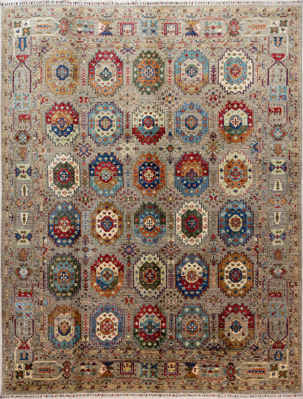 Authentic Handknotted Grey Afghan Suzani Chobi Wool Rug 309cm x 232cm woven in Shebarghan, Northern Afghanistan
A grey field supports&nbsp; multicoloured Filipa type guls all over. In this rug the negative spaces between guls are filled with delicate atomic or Nordic feel, branching motifs giving the impression of two rugs in one.
Beautifully decorated 'Ariana' tassles on each end
Colour tones all made from local vegetable/plant based dyes