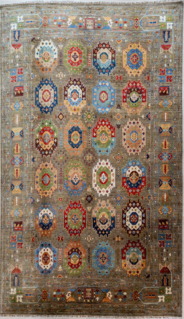Authentic hand woven Grey Fine XL Afghan Suzani Chobi Wool Rug 422cm x 302cm woven in Shebarghan, Northern Afghanistan
All over design of large elephant foot guls with serrated edges. The base colour is soft rabbit grey and guls feature a lovely salmon pink amid other natural vegetable dyed tone
Intricately hand woven with tight knots and perfect finishings, this is a one of a kind piece in this lhard to get arger size