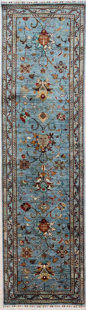 Made with a Cool ice blue background and multicoloured colour-fast, veg dyed renditions of floral and vine elements.
Woven in Shebarghan Central Afghanistan, this lovely spirited garden inspired design and colour combination enhances and brightens your hallway as well as reducing noise.

Having a light and darker aspect is a trademark of Handmade Rugs
Durable and Wear Resistant Suitable for High Traffic Areas