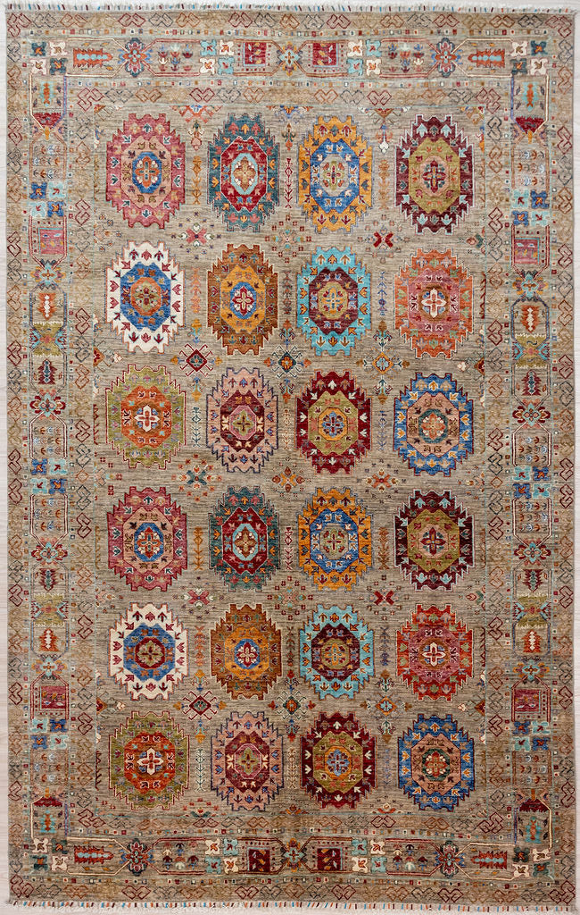 Authentic Handknotted Fawn Afghan Suzani Chobi Wool Rug 315cm x 211cm woven in Shebarghan, Northern Afghanistan by master craftswomen.
Lovely combination of fawn natural sheep wool colour background field with interesting varied gul motifs.

Beautifully decorated 'Ariana' tassels.
Colour tones all made from local vegetable/plant based dyes These artisans preserve a heritage of ancient traditional recipes using trees and the plants from beneath their feet.
Perfect to brighten your room