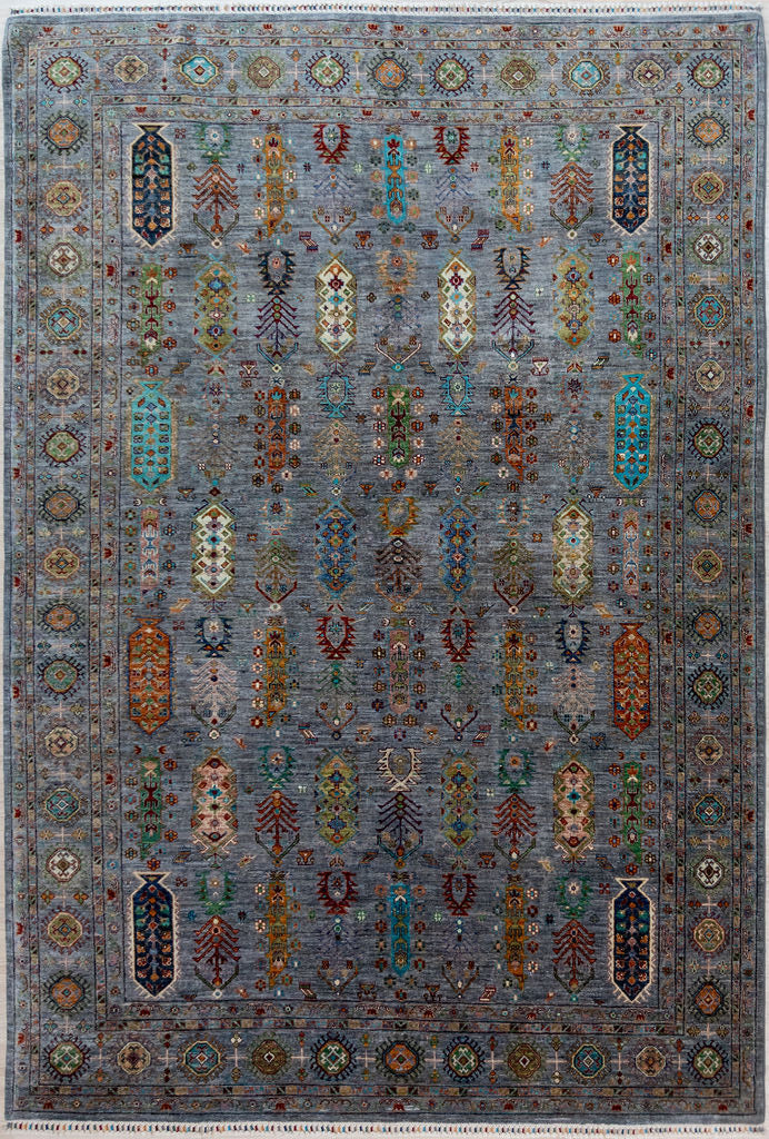 Authentic Large Handmade&nbsp;Grey Pictorial Afghan Suzani Chobi Wool Rug 346cm x 252cm made by local artisans of Sehbarghan, Northern Afghanistan
Tree of life and other motifs and symbols drawn from cultural memory adorn this large hearth warmer.
A background of natural grey Ghazni mountain sheep's'wool displays contains a full range of beautiful natural veg dyed colours accented with contrasting flashes of natural cream.

A one of a kind example of dyeing and weaving artistry
