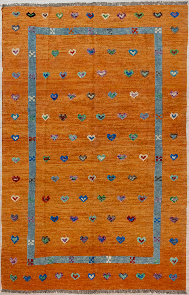 Orange Barjasta Afghan Wool Kilim 294cm x 201cm
Guaranteed Original Pure Wool with textured wool pile diamonds of different colours and a turquoise border, all on a burnt orange abrash wool background.
Texture is formed by deliberately spinning together different dye batches
Durable and Wear Resistant Suitable for High Traffic Areas