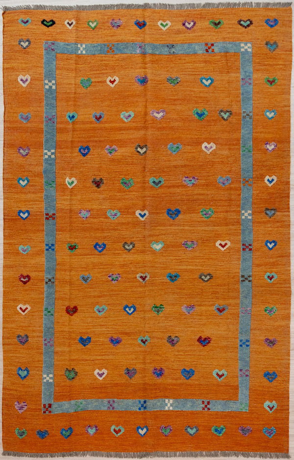 Orange Barjasta Afghan Wool Kilim 294cm x 201cm
Guaranteed Original Pure Wool with textured wool pile diamonds of different colours and a turquoise border, all on a burnt orange abrash wool background.
Texture is formed by deliberately spinning together different dye batches
Durable and Wear Resistant Suitable for High Traffic Areas