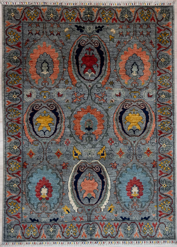 Lovely Natural veg dyed colour palette depicts multiple votive niche designs with a warm grey background of natural grey fleece. The wide undulating border gives a finishing touch.

Stylish and practical Ariana tassels woven on the ends of the rug&nbsp;
Having a light and darker aspect is a trademark of Handmade Rugs
Durable and Wear Resistant Suitable for High Traffic Areas