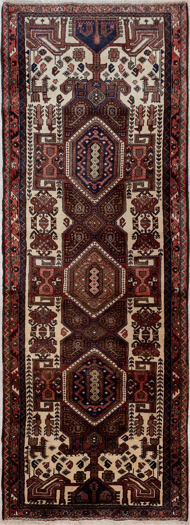 Guaranteed Original Vintage Persian Hamadan Wool Runner 298cm x 109cm woven in Central Asia.
A rug in earthy tones as was popular in mid century decor. Features rams horn symbols, a sign of fertility and some Djore motifs in the border. Clear natural cream wool outlines the complex design.
Having a light and darker aspect side is a trademark of Handmade Rugs
Durable and Wear Resistant Suitable for High Traffic Areas