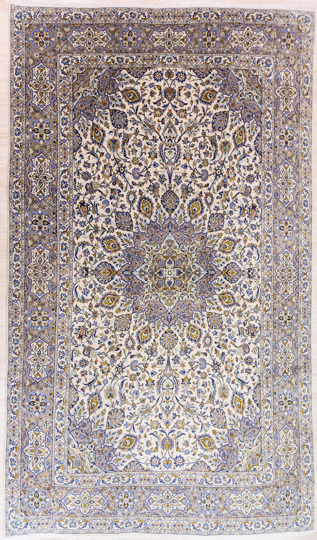 Guaranteed Original XL Cream Fine Persian Kashan Wool Rug 420cm x 300cm hand knotted in the city of Kashan, Iran
Beautiful traditional design with central medallion in pale tones and a rare very large and extra long size.
A colour mix of pale blue, rust cream, indigo and beige/white
Having a lighter and darker aspect is a trademark of Handmade Rugs
Durable and Wear Resistant
All Colours in This Piece Originate from Natural Vegetable Dyes