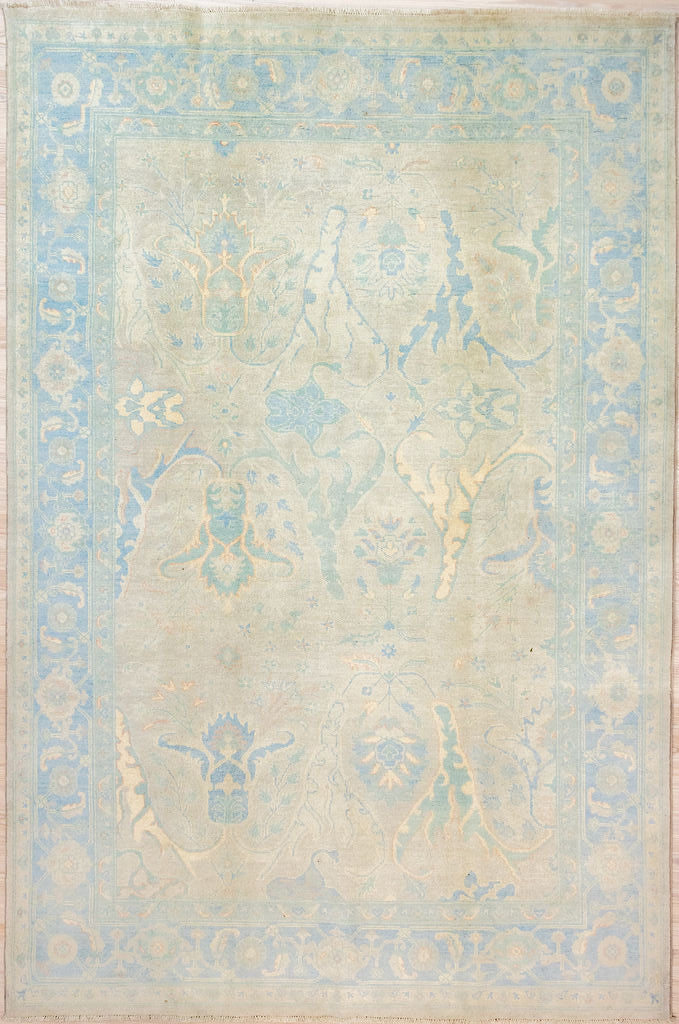 Authentic Hand Knotted Grey Muted Afghan Chobi Wool Rug 283cm x 197cm
This rug has a misty Muted Grey background and soft images of acanthus iris and lilies in a wide ornate blue and cream floral border.
Less is more with the subtle colour tones in this rug . All made with natural vegetable dyes keeping your air quality healthy
Oushak Design light toned rug brightens your interior and opens your space
This is a one of a kind piece ideal with both Modern Contemporary and Traditional settings