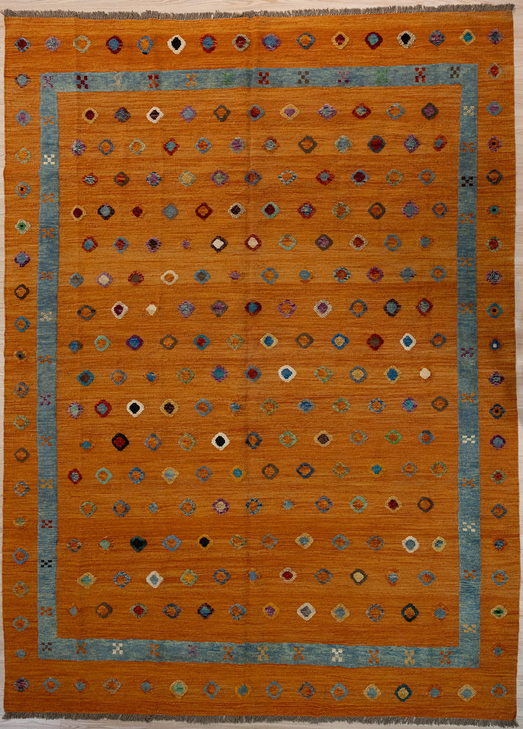 Large Orange Terracotta Barjasta Afghan Wool Kilim 342cm x 259cm
Guaranteed Original Persian Kilim Pure Wool with textured wool pile diamonds of different colours and a border on an orange terracotta abrash wool background.
Texture is formed by deliberately spinning together different dye batches.Durable and Wear Resistant Suitable for High Traffic Areas