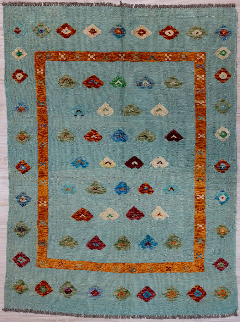 Light Blue Barjasta Afghan Wool Kilim 197cm x 148cm
Guaranteed Original Persian Kilim Pure Wool with textured wool pile diamonds of different colours and a border on a light indigo blue wool background.&nbsp;
modern light colours nice for coastal feel.
Durable and Wear Resistant Suitable for High Traffic Areas