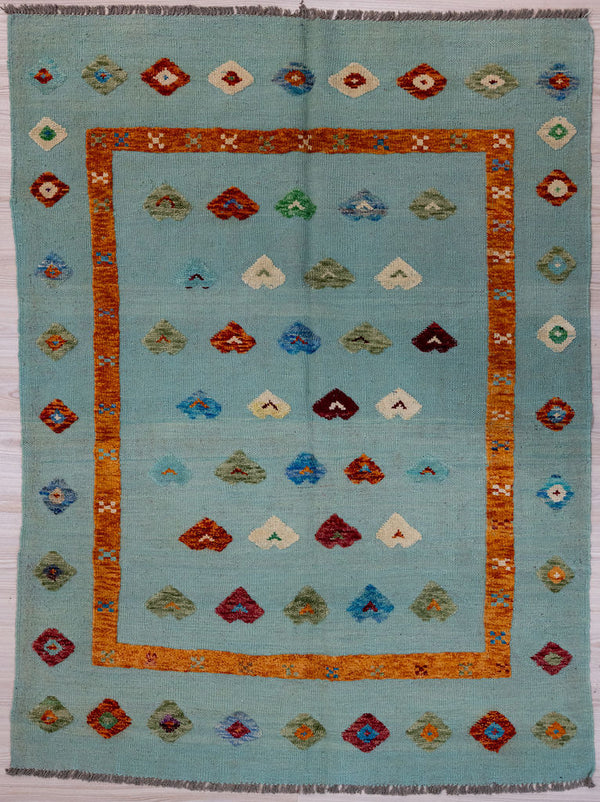 Light Blue Barjasta Afghan Wool Kilim 197cm x 148cm
Guaranteed Original Persian Kilim Pure Wool with textured wool pile diamonds of different colours and a border on a light indigo blue wool background.&nbsp;
modern light colours nice for coastal feel.
Durable and Wear Resistant Suitable for High Traffic Areas