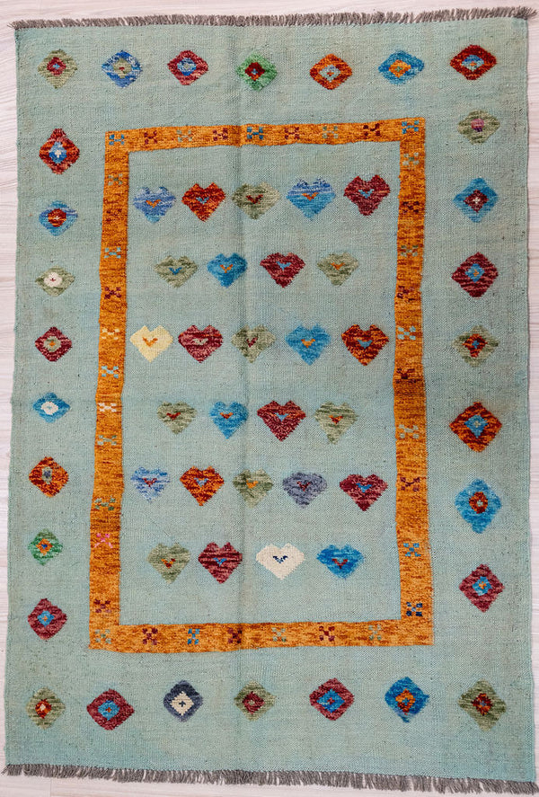 Light Green Barjasta Afghan Wool Kilim 196cm x 144cm
Guaranteed Original Persian Kilim Pure Wool with textured wool pile diamonds of different colours and a border on a light green wool background.
Lovely sensory rug for children