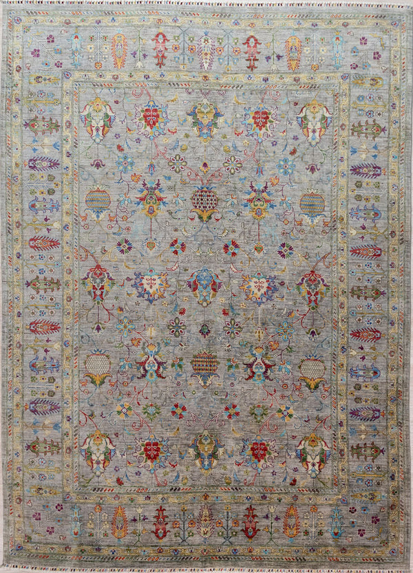 Authentic Handknotted Light Grey Afghan Sultani Chobi Wool Rug 316cm x 249cm
Finely handknotted by female artisans of Northern Afghanistan
This desgn is a delight of delicate curvilinear tracery and botanical references to local plants and herbs such as pomegranate. This fruit is an important ancient food and an important source of dyeing and leather tanning substances.
Light Grey field and multicolour tone combination all made from locally sourced natural dyes or the natural varied colous of wool.