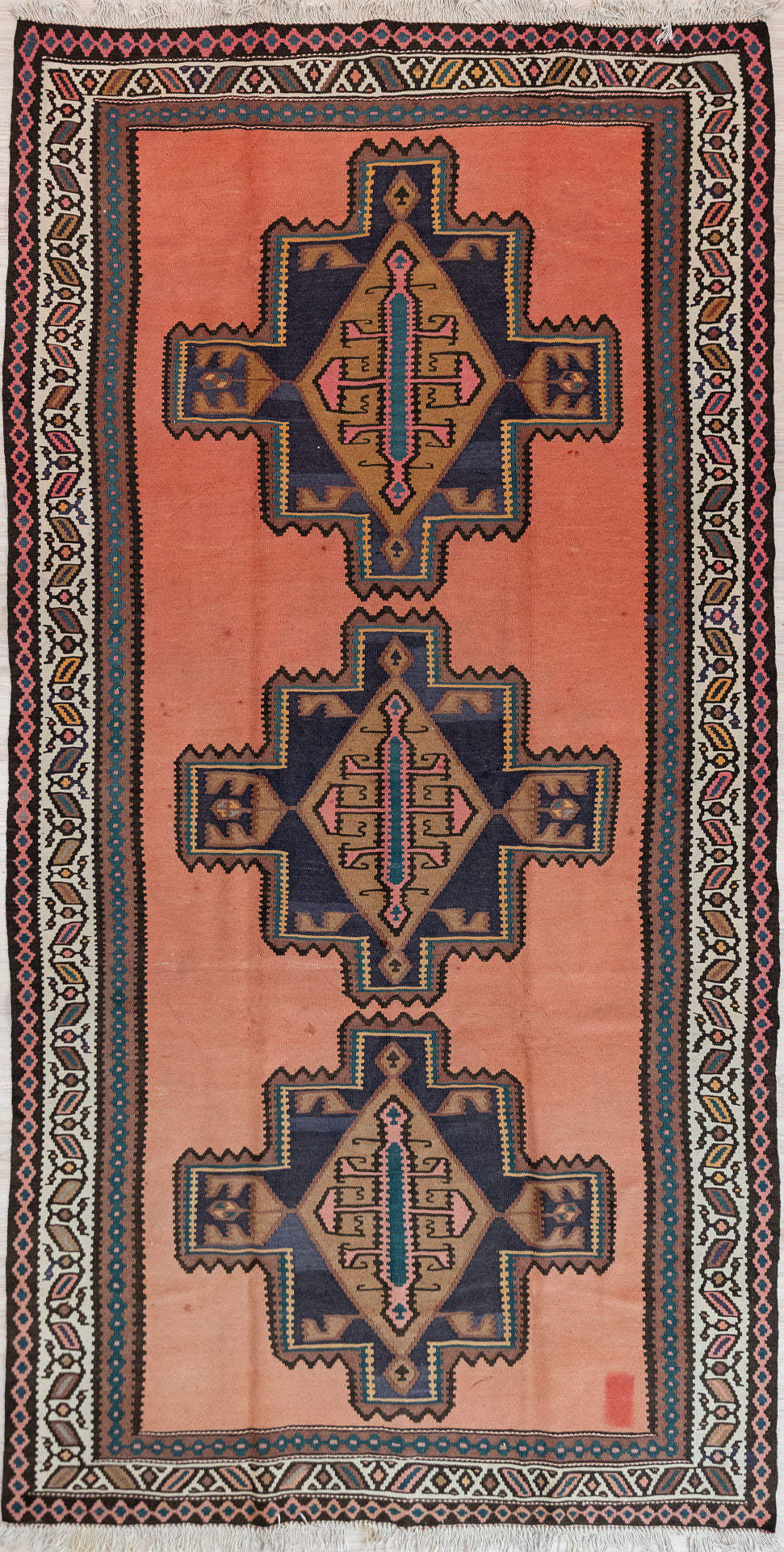 Authentic Hand Knotted&nbsp; Light Pink c1970's Turkish Wool Kilim 295cm x 166cm
A tribal design woven from memory in popular midcentury colours of dusty pink, browns, orange and deep blue this rug is a good size for a galley kitchen or sunroom
The rug has a complex border and the colour tones have aged gracefully over the decades and the wool softened.
Kilims are a light flatweave reversible rug used for over a millennium by the nomadic tribes of Central Asia

Durable and Wear Resistant Suitabl