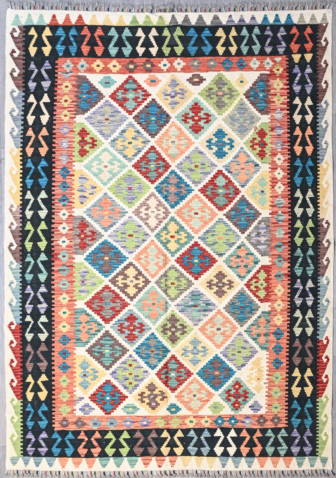 Authentic Handknotted Multicolour Afghan Boho Kilim Wool Rug 253cm x 179cm
Having a light and dark side is a trademark of Handmade Rugs
Durable and Wear Resistant Suitable for High Traffic Areas